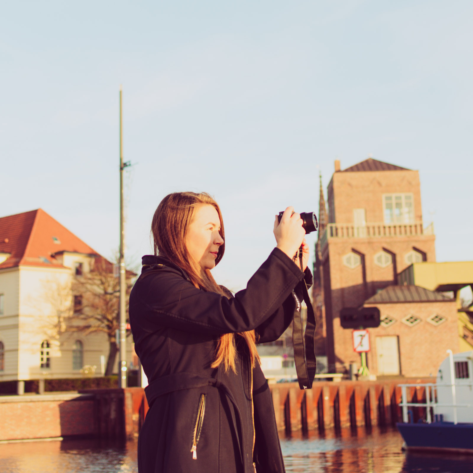 Sarah with her camera in sunshine