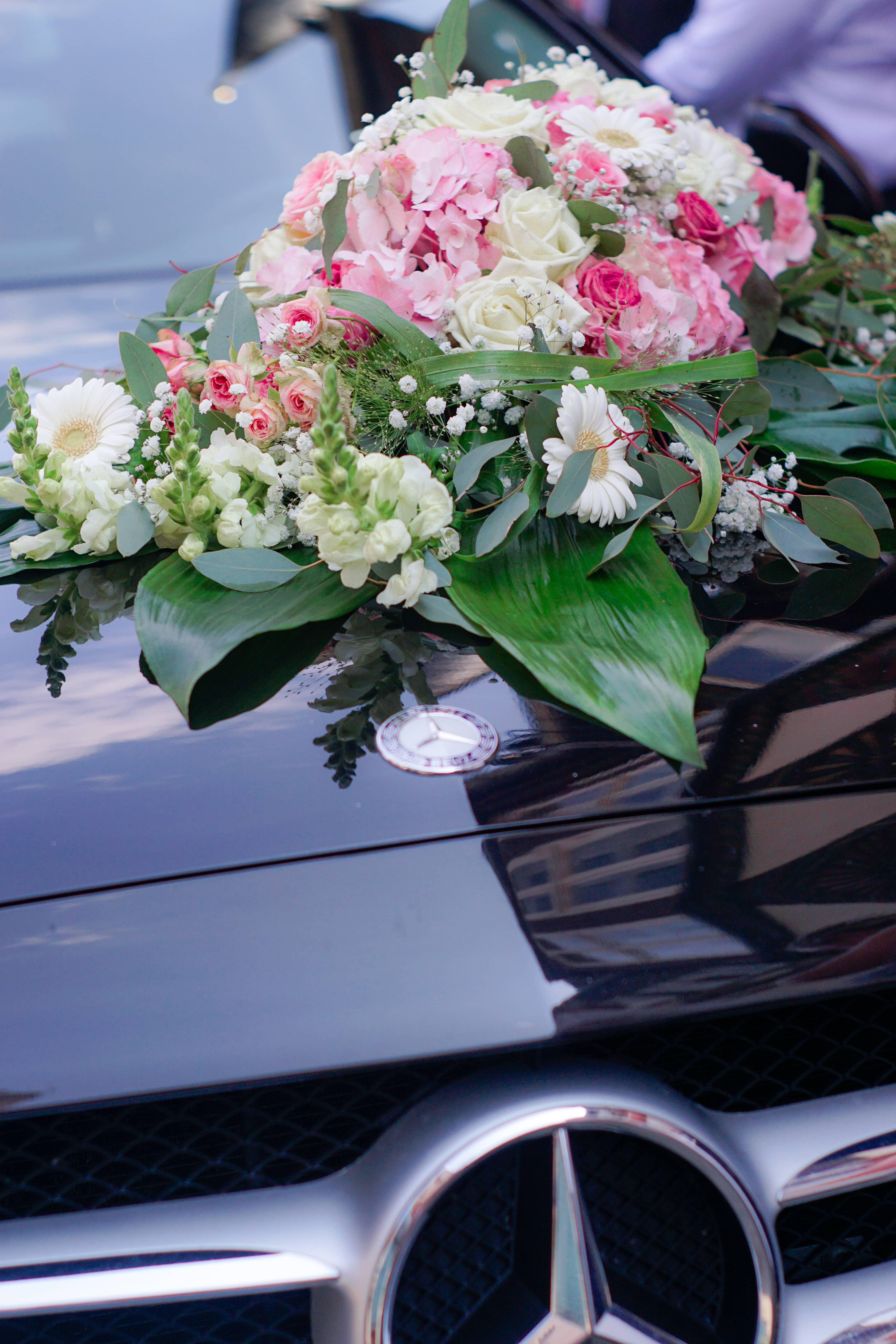 Wedding car mercedez benz with huge white and pink flowers